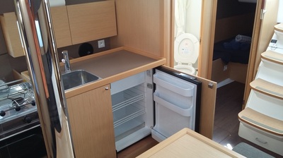 The kitchen with fridge detail of the Beneteau Oceanis 38.1