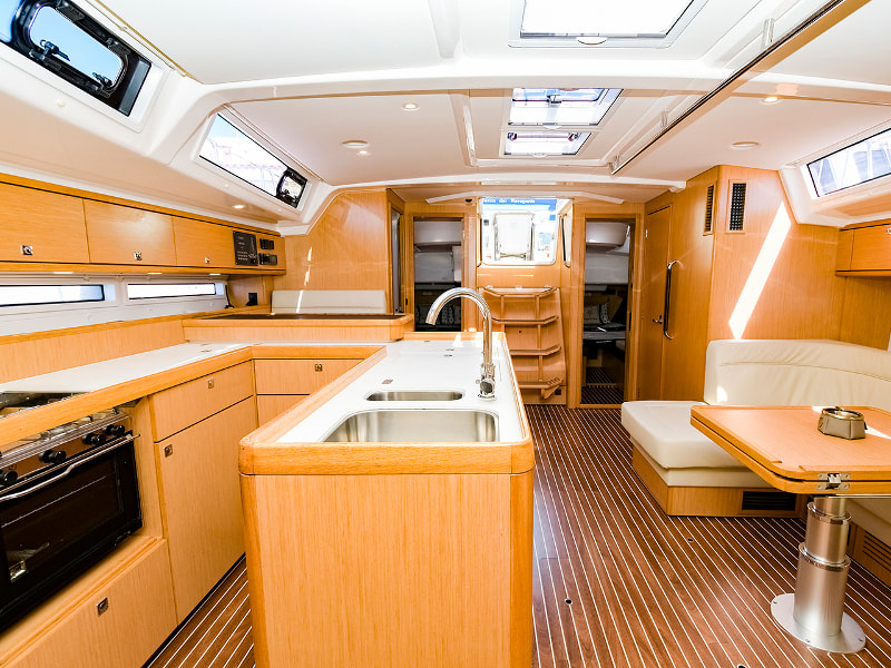 Saloon and kitchen of the sailing boat Bavaria 56