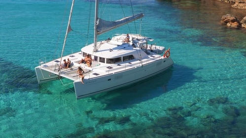 Catamaran anchored in a beautiful place of Ibiza