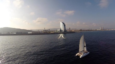 The catamaran sailing in front of Hoterl W