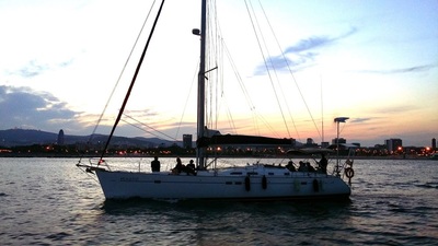 Barcelona sunset sailboat background