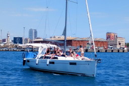 Sunbathing on the deck of the sailboat while visiting Port Vell-Barcelona