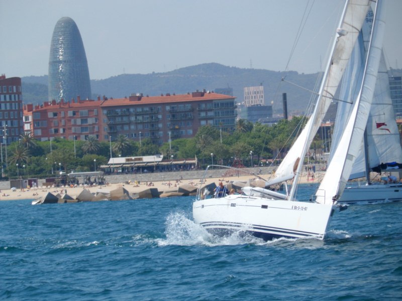 Sailing in the regatta field with Barcelona in the back