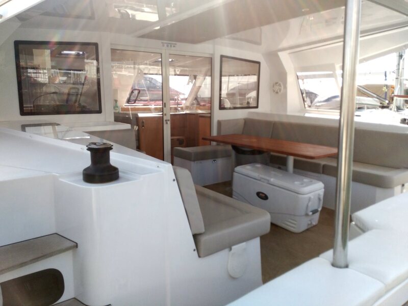 Lounge area in the back of the sailing catamaran Premium to rent in Barcelona