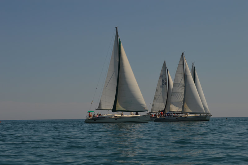Sailboats fighting the position during the regatta