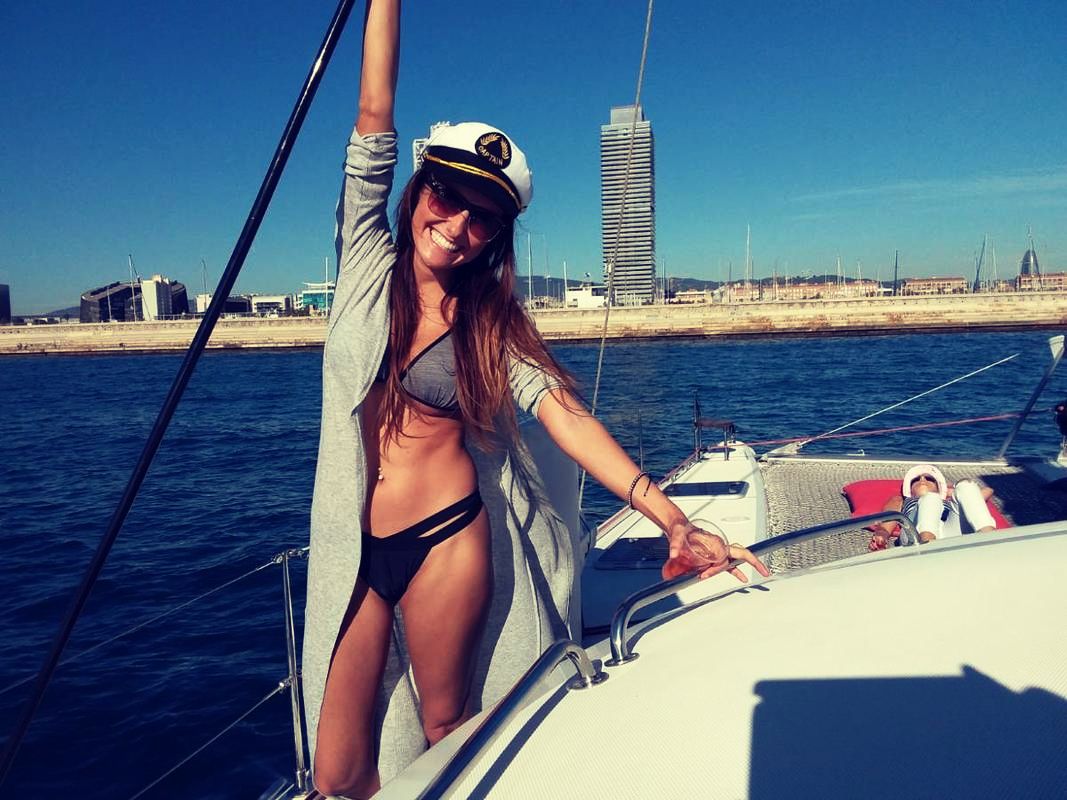 A girl in the catamaran for a hen do party by boat in Barcelona