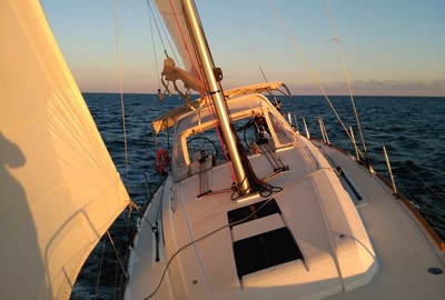 Sailing with genoa sail at the sunset