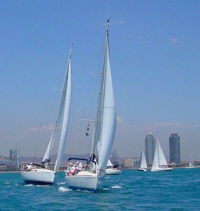 The sailboats in the regatta field in front of Barcelona